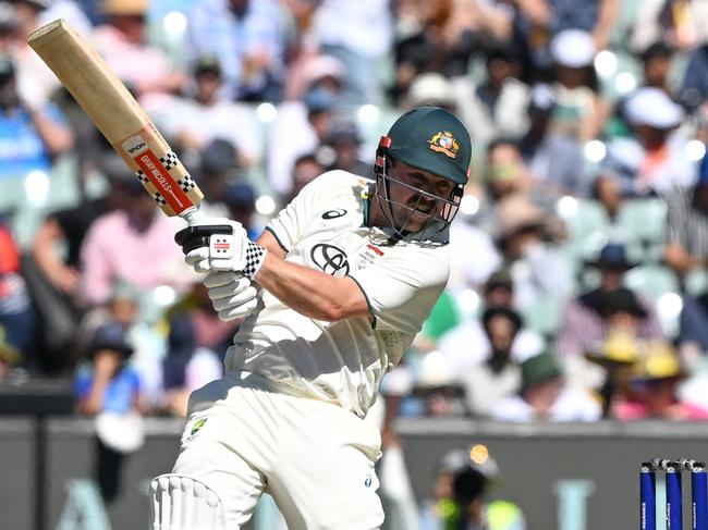 Australia's Travis Head plays a shot on the second day of the second Test cricket match between Australia and India at the Adelaide Oval in Adelaide on December 7, 2024. (Photo by Michael ERREY / AFP) / -- IMAGE RESTRICTED TO EDITORIAL USE - STRICTLY NO COMMERCIAL USE --