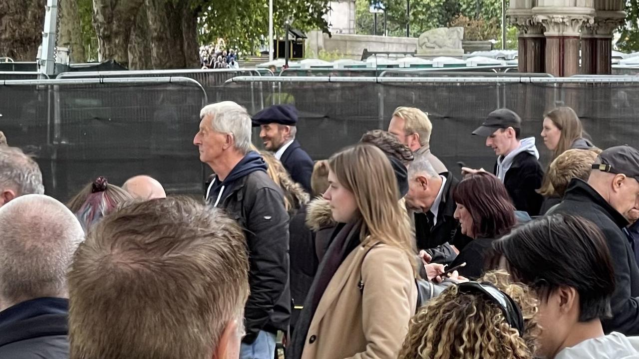 David Beckham (centre) lined up with the general public for many hours to pay his respects to the Queen.