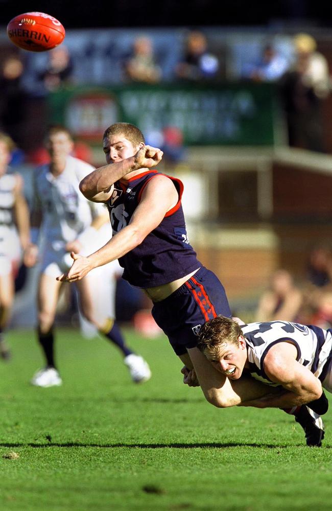 “Robbo’’ on the go: David Robbins handballing for Springvale in 2000.