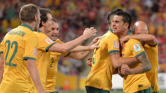 BRISBANE, AUSTRALIA - JANUARY 22: Tim Cahill of Australia celebrates with team mates after scoring a goal during the 2015 Asian Cup match between China PR and the Australian Socceroos at Suncorp Stadium on January 22, 2015 in Brisbane, Australia. (Photo by Bradley Kanaris/Getty Images)