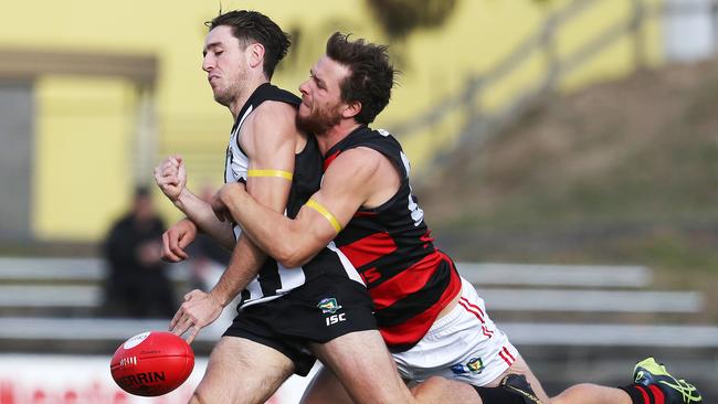 Nat Franklin mows down Glenorchy’s James Webb in a strong tackle. Picture: NIKKI DAVIS-JONES