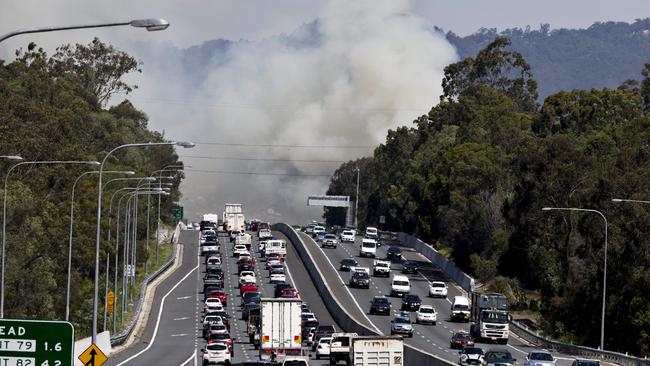 Traffic is slowed along the M1 heading south due to a grass fire along Mudgeeraba Rd, Mudgeeraba. Photo: Jerad Williams