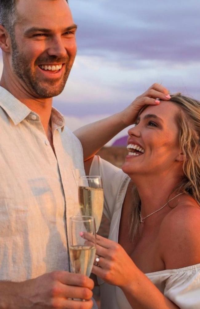 Holmes and now husband Keegan Brooksby when they became engaged at Uluru in 2020. Picture: Supplied