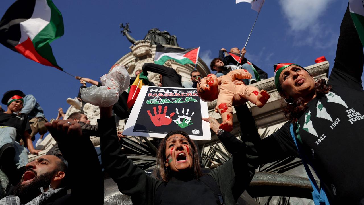 Protesters chant as they stand on the Monument a la Republique in Paris during a demonstration calling for peace in Gaza. Picture: AFP