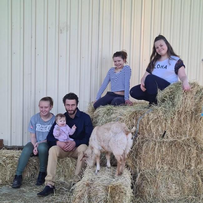 Mr Donnelly, pictured here with his kids, is dying of silicosis. He has shared horror images of Aussie homes coated in the dust. Picture: Supplied