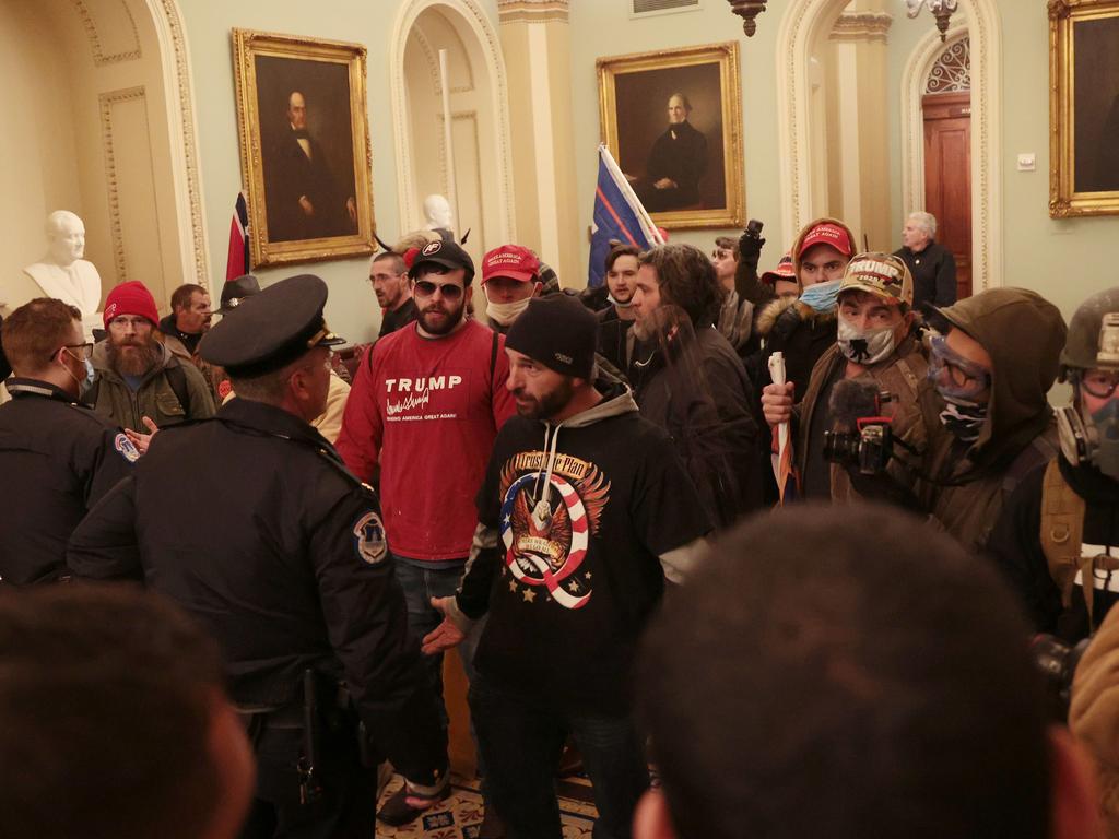 Protesters interact with Capitol Police inside the US Capitol Building. Picture: AFP