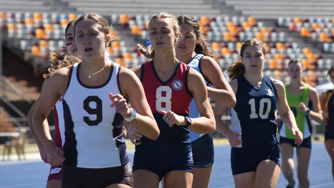 Keira Moore, No.8, at the 2021 QG track and field meet. Her sister Zara is following in her footsteps.