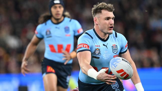 BRISBANE, AUSTRALIA - JULY 17: Angus Crichton of the Blues passes during game three of the 2024 Men's State of Origin series between Queensland Maroons and New South Wales Blues at Suncorp Stadium on July 17, 2024 in Brisbane, Australia. (Photo by Bradley Kanaris/Getty Images)