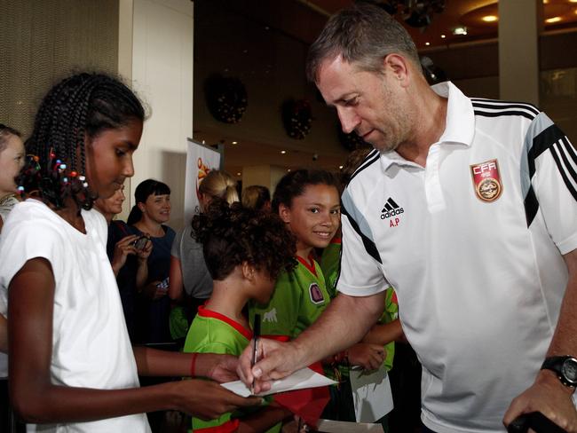 China coach Alain Perrin is welcomed by an Aboriginal dancing group.