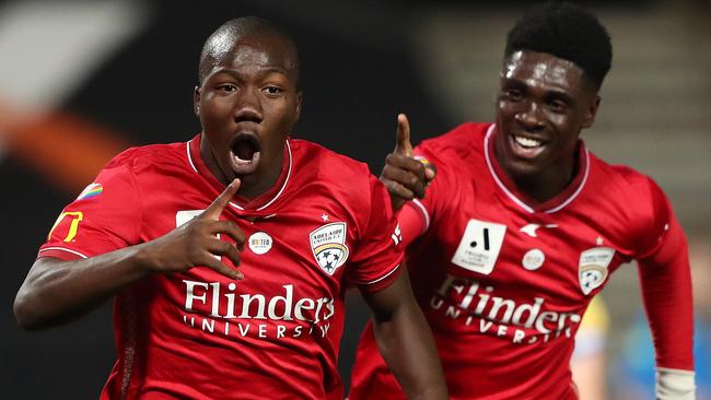 Nestory Irankunda (left) celebrates a winning goal during last A League season. Picture: Sarah Reed/Getty Images