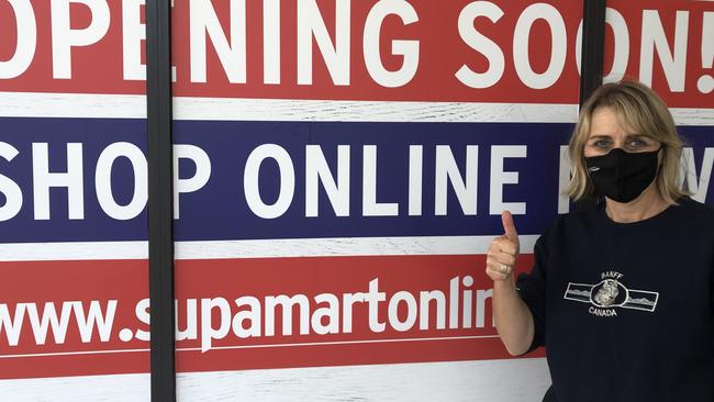 Freshwater resident Lisa Reizes outside the IGA Supamart supermarket in Albert St, Freshwater. The mother of two is thrilled that the long delayed supermarket will be opening "soon". Picture: Jim O'Rourke