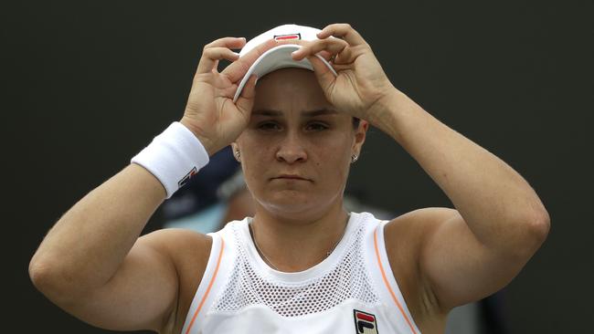 Australia's Ashleigh Barty adjusts her cap during a break in a women's singles match against United States' Alison Riske. Picture: AP