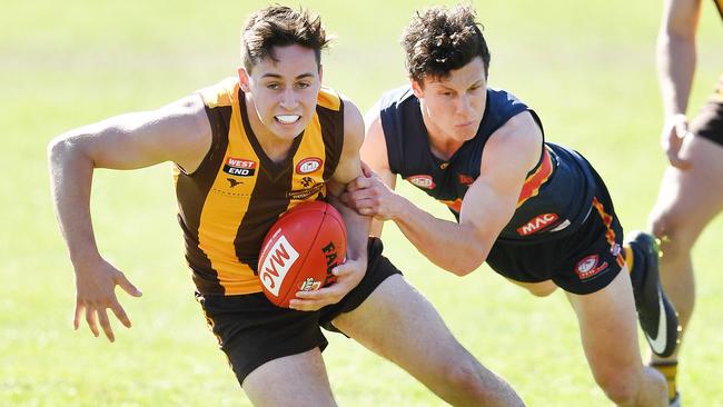 Langhorne Creek’s Jake Dominish evades a tackle from McLaren’s James Mathews during last year’s grand final. Picture: Image AAP/Mark Brake