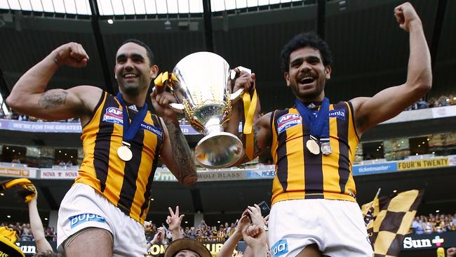 Shaun Burgoyne and Cyril Rioli celebrate with the 2015 premiership cup. Picture: Wayne Ludbey