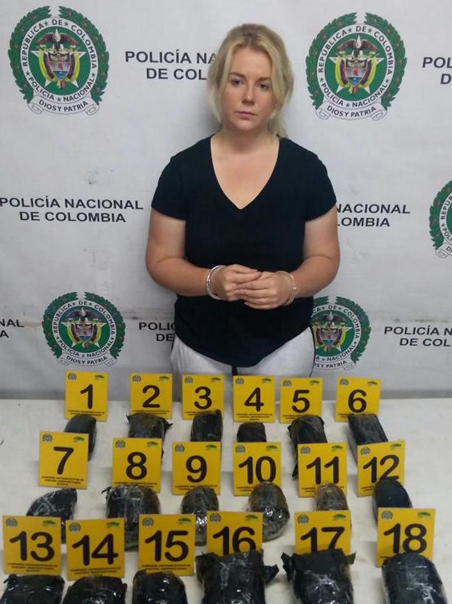 Cassandra Sainsbury shortly after her arrest in 2017 with the 5.8 kilos of cocaine concealed in 18 black headphones. Picture: EPA/Col Anti-narcotics Police