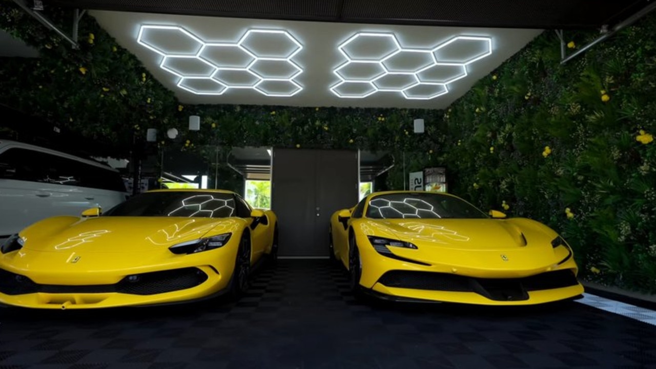 One of his joys is luxury vehicles like these two Ferraris but he was also proud of the only garden wall ever put into a garage in his reno. Picture: YouTube