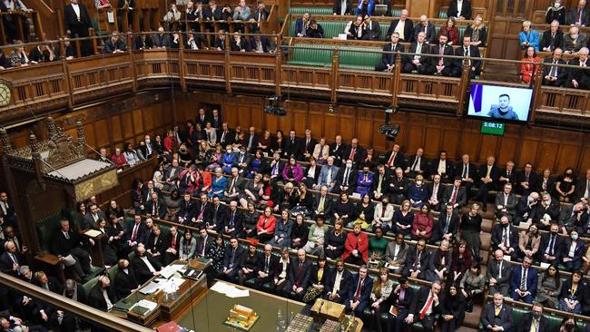 UK MPs listen to Ukraine's President Volodymyr Zelensky speaking to them by live video-link in the House of Commons in London on March 8.