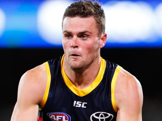 ADELAIDE, AUSTRALIA - JULY 20: Brad Crouch of the Crows runs with the ball during the round 7 AFL match between the Adelaide Crows and the St Kilda Saints at Adelaide Oval on July 20, 2020 in Adelaide, Australia. (Photo by Daniel Kalisz/Getty Images)