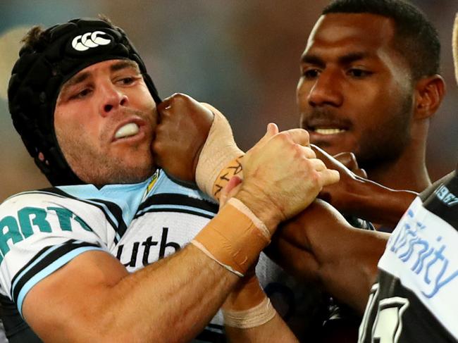 Shark's Michael Ennis gets into a fight during the 2016 NRL Grand Final between the Cronulla Sharks and the Melbourne Storm at ANZ Stadium , Homebush . Picture : Gregg Porteous