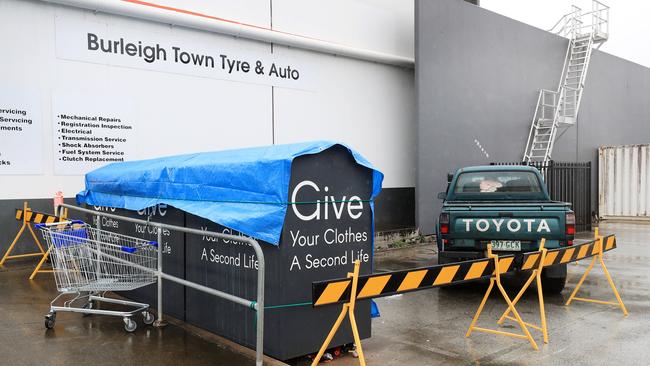 Police have set up a crime scene after a woman was found dead inside a charity clothing bin outside a Gold Coast store at Stocklands shopping centre Burleigh Heads. Picture: NCA NEWS WIRE / Scott Powick