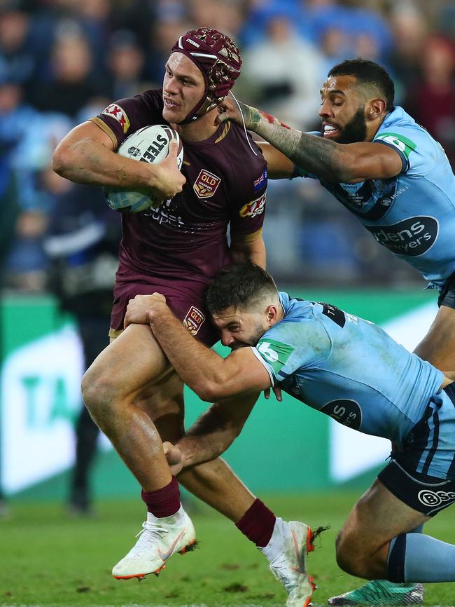 ‘Budding superstar’ ... Kalyn Ponga tries to bust through the Blues defence. Photo: Getty Images