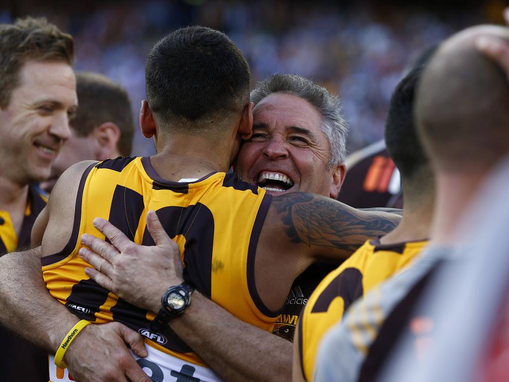 Chris Fagan celebrates Hawthorn’s 2014 premiership with Brad Hill.