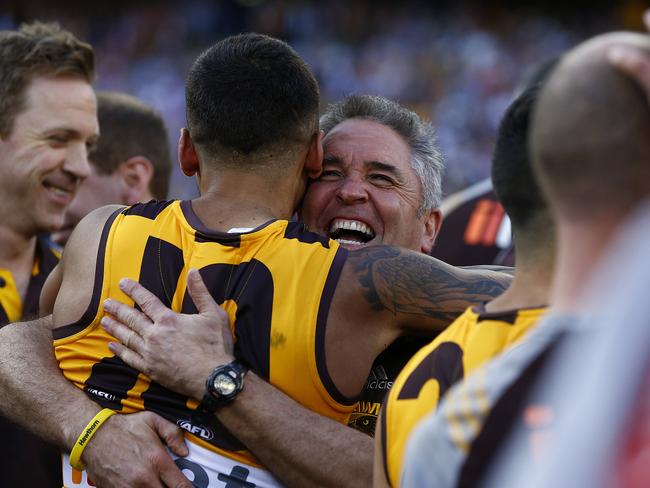 Chris Fagan celebrates Hawthorn’s 2014 premiership with Brad Hill.