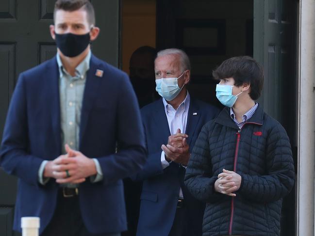 Joe Biden, centre, donned a mask for the church service. Picture: AFP