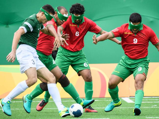 Brazil's Cassio (L) controls a ball against Morocco during their Men's football 5-a-side match against Brazil during the Rio 2016 Paralympic Games, at the Olympic Park in Rio de Janeiro, Brazil, on September 9, 2016. / AFP PHOTO / YASUYOSHI CHIBA