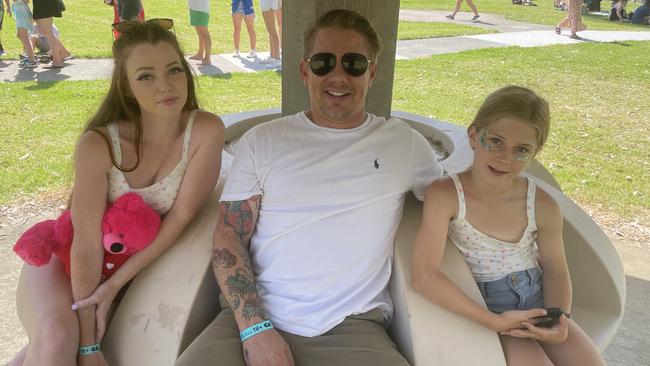 St Kilda’s Nicole and Sam Potter with Sam’s daughter Charlotte, 9, at Hello Sunshine Festival in Scoresby.