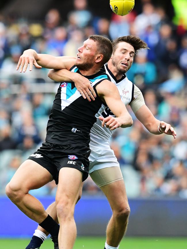 The Power’s Brad Ebert and Carlton’s Dale Thomas in action when the AFL clubs last met in round two this year. Picture: Mark Brake/Getty Images