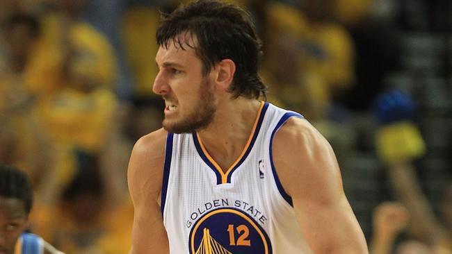 OAKLAND, CA - APRIL 28: Andrew Bogut #12 of the Golden State Warriors celebrates against the Denver Nuggets during Game Four of the Western Conference Quarterfinals of the 2013 NBA Playoffs at ORACLE Arena on April 28, 2013 in Oakland, California. NOTE TO USER: User expressly acknowledges and agrees that, by downloading and or using this photograph, User is consenting to the terms and conditions of the Getty Images License Agreement. (Photo by Jed Jacobsohn/Getty Images)