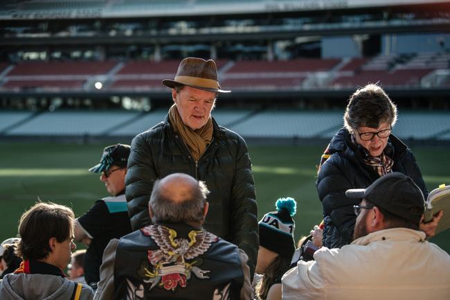 Director Mark Lamprell and and Susie Struth talk to actors in front of Crows and Port Adelaide fans. Picture: Morgan Sette/The Advertiser