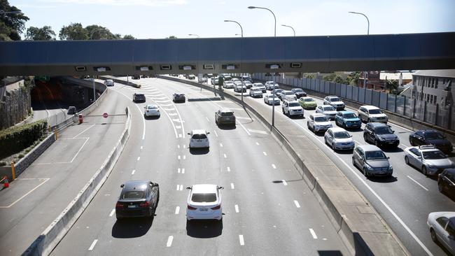 Motorist driving through the Eastern Distributor toll point at Woolloomooloo. Picture: Jonathan Ng