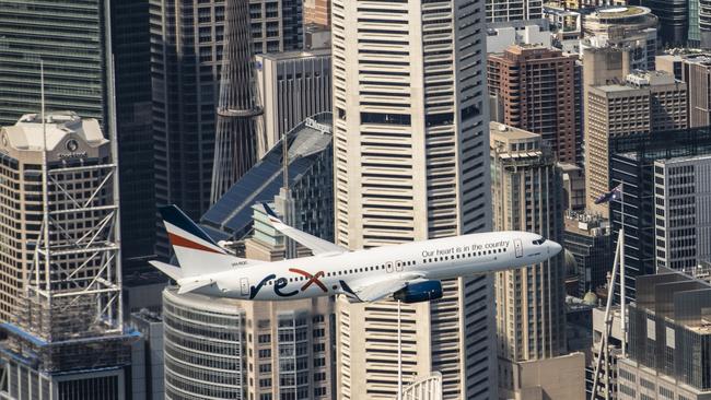 Rex sent its 737 over Sydney's CBD to mark Australia Day, 2021 and promote its upcoming flights from Melbourne to the city. Picture: Joe Corrigan