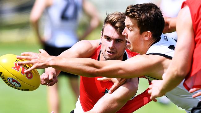 Recruit Jack Trengove gets a hand to the ball during a competitive drill at Port Power training. Picture: AAP Image/Mark Brake