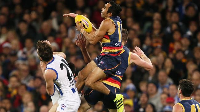 Eddie Betts climbs over the pack to take a big mark.