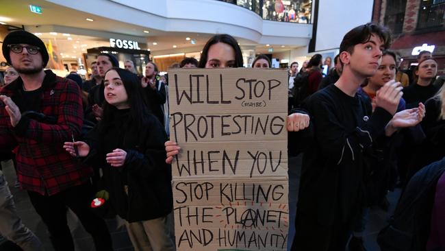 Climate change protesters temporarily disrupt Melbourne Central. Picture: Jake Nowakowski