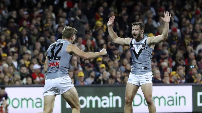 Dougal Howard celebrates another goal with Sam Gray to silence the Crows home crowd. Picture SARAH REED