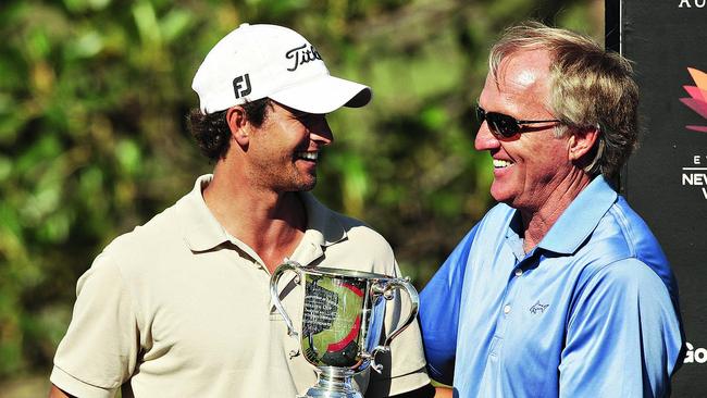 Mentor: Norman presents Adam Scott with the 2009 Australian Open trophy. Pic: Phil Hillyard