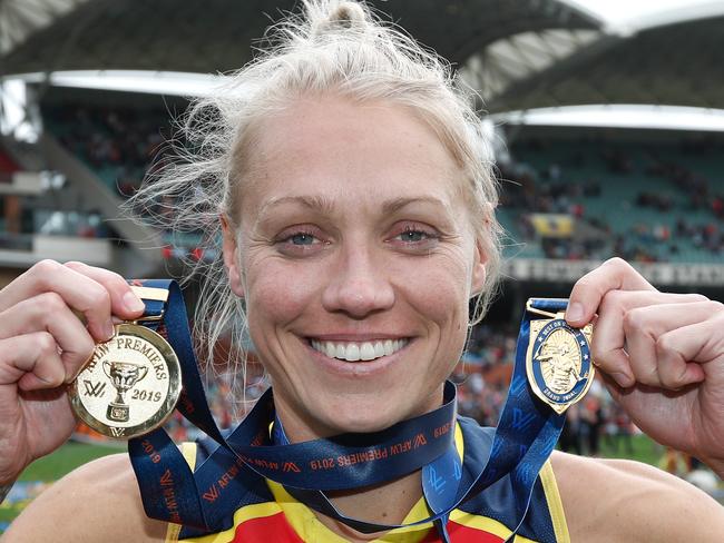 ADELAIDE, AUSTRALIA - MARCH 31: Erin Phillips of the Crows poses for a photograph with her Premiership Medal and Best On Ground Medal during the 2019 AFLW Grand Final match between the Adelaide Crows and the Carlton Blues at Adelaide Oval on March 31, 2019 in Melbourne, Australia. (Photo by Michael Willson/AFL Photos)