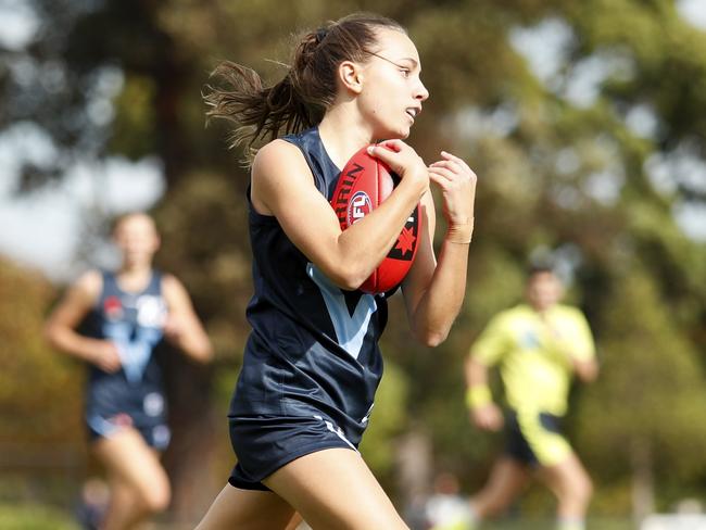 MELBOURNE, AUSTRALIA - APRIL 13: Rylie Wilcox of Vic Metro marks the ball during the 2021 AFLW U17 Championships match between Vic Country and Vic Metro at Warawee Park on April 13, 2021 in Melbourne, Australia. (Photo by Dylan Burns/AFL Photos)