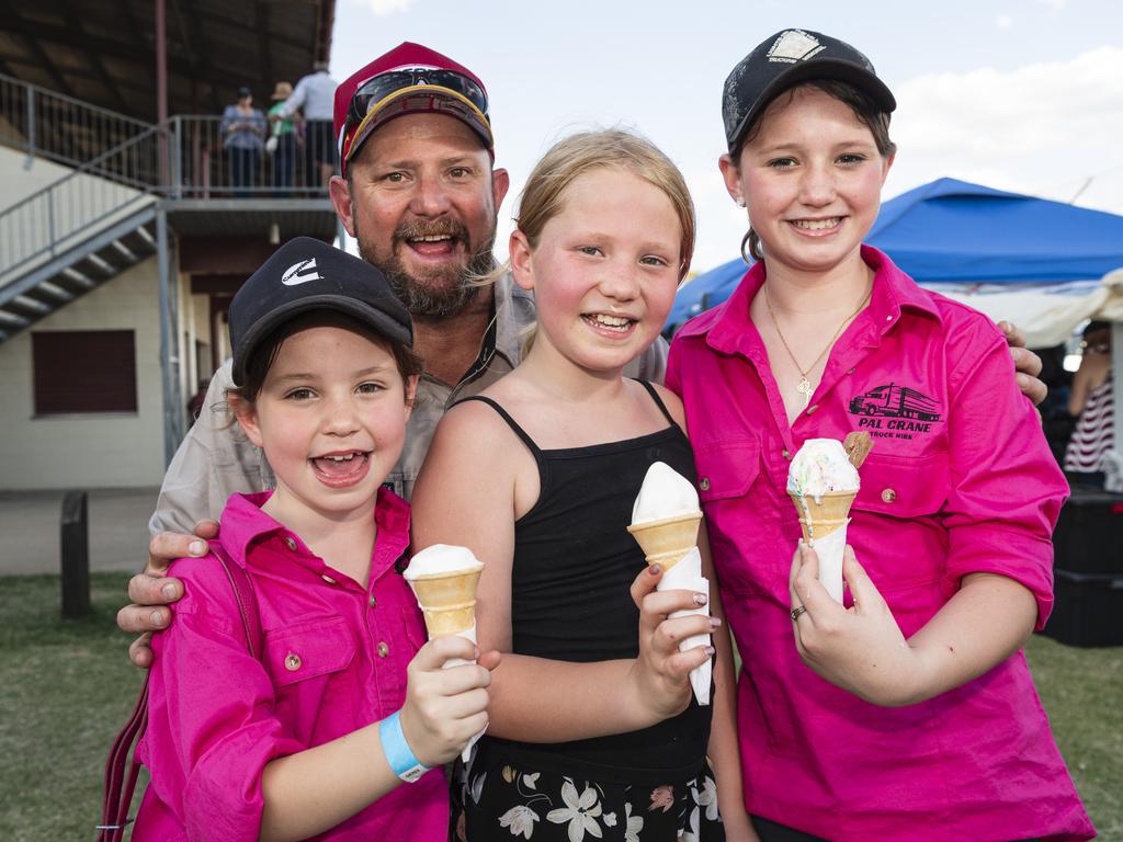 Cameron Howard and his daughters (from left) Lauren, Grace and Courtney Howard cool down with ice creams at the Lights on the Hill Trucking Memorial at Gatton Showgrounds, Saturday, October 5, 2024. Picture: Kevin Farmer