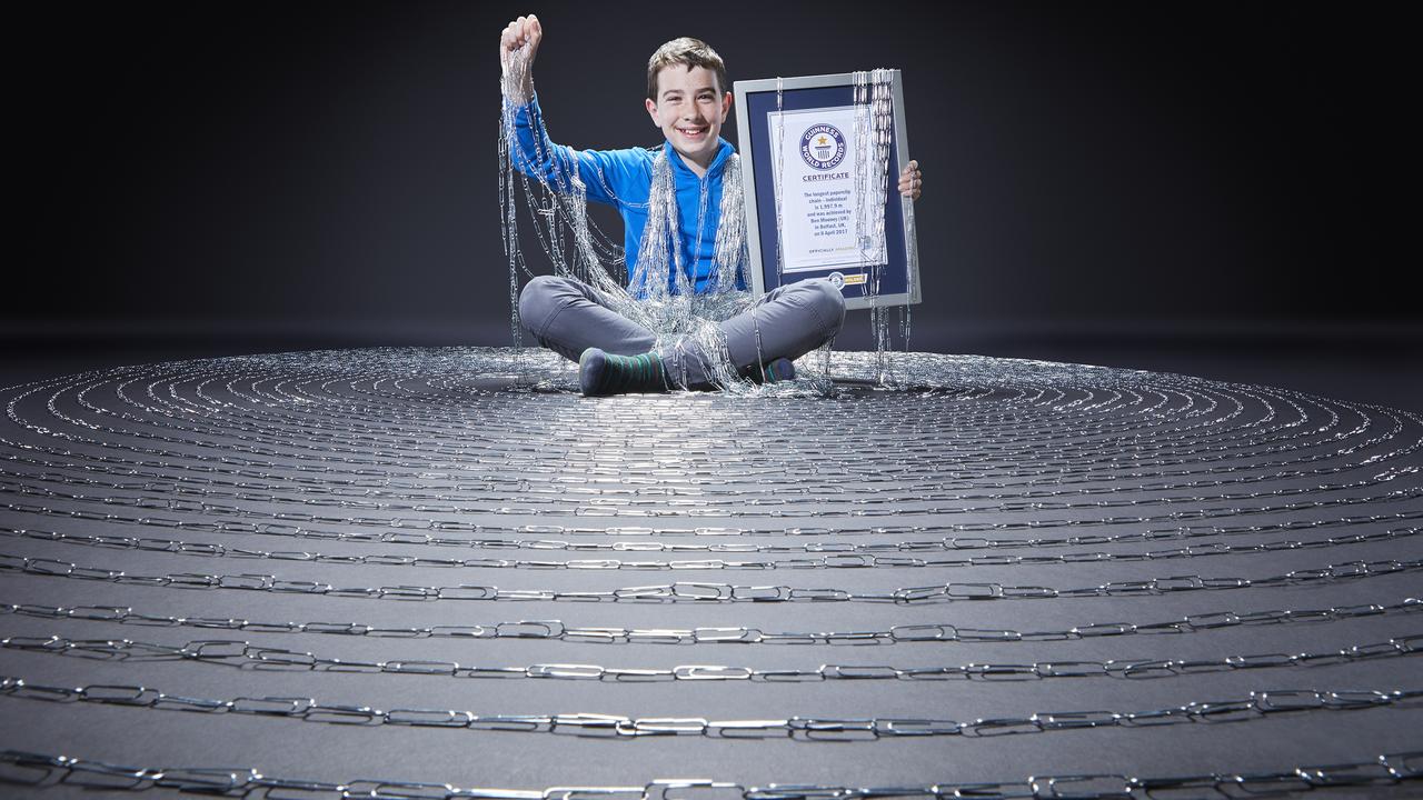 Ben Mooney with the world’s longest paperclip chain. Picture: Guinness World Records