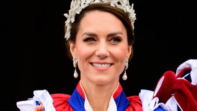 LONDON, ENGLAND - MAY 06: Catherine, Princess of Wales stands on the balcony of Buckingham Palace with Prince Louis during the Coronation of King Charles III and Queen Camilla on May 06, 2023 in London, England. The Coronation of Charles III and his wife, Camilla, as King and Queen of the United Kingdom of Great Britain and Northern Ireland, and the other Commonwealth realms takes place at Westminster Abbey today. Charles acceded to the throne on 8 September 2022, upon the death of his mother, Elizabeth II.  (Photo by Leon Neal/Getty Images)