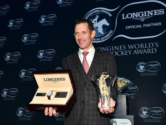 HONG KONG - DECEMBER 08:  Australian jockey Hugh Bowman poses with trophy and watch after being awarded 2017 Longines World's Best Jockey Award  during the Gala Dinner for the Longines Hong Kong International Races on December 8, 2017 in Hong Kong, Hong Kong.  (Photo by Vince Caligiuri/Getty Images)