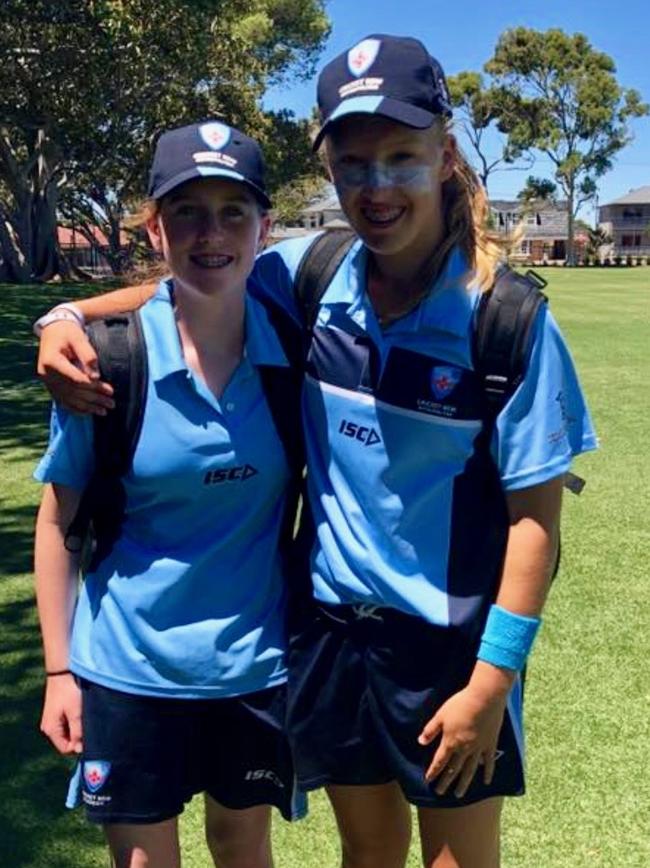 Young cricketer Claire Moore with her mate Hayley Silver-Holmes. Pic: Supplied