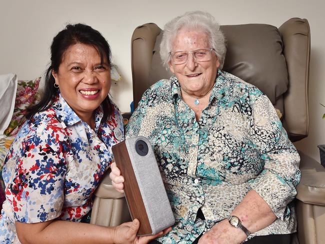 MELBOURNE, AUSTRALIA - February 8TH, 2023: A HomeGuradian intelligence device is being trialled for elderly, to prevent falls.Aged care resident Sister Gabriel, with VMCH staff member Estela and the device.Picture: Nicki Connolly