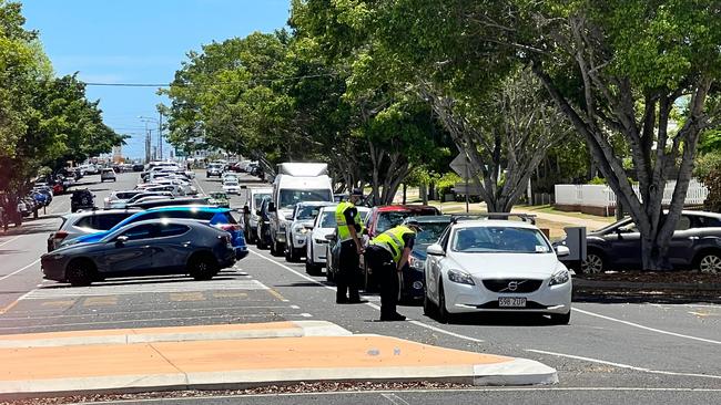 Cars are being turned away at the Bundaberg Hospital fever clinic by Police after a surge in close contact sites.