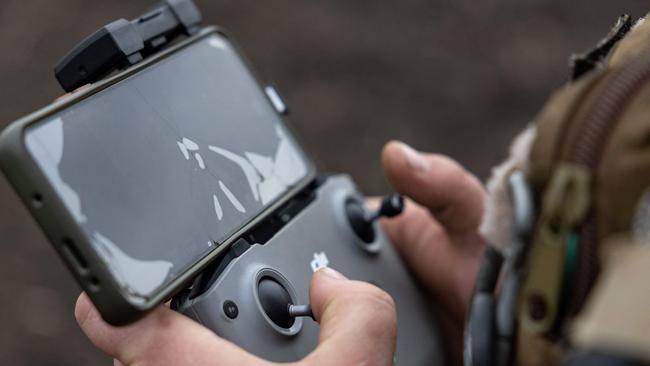 A Ukrainian serviceman controls a drone. Picture: AFP.